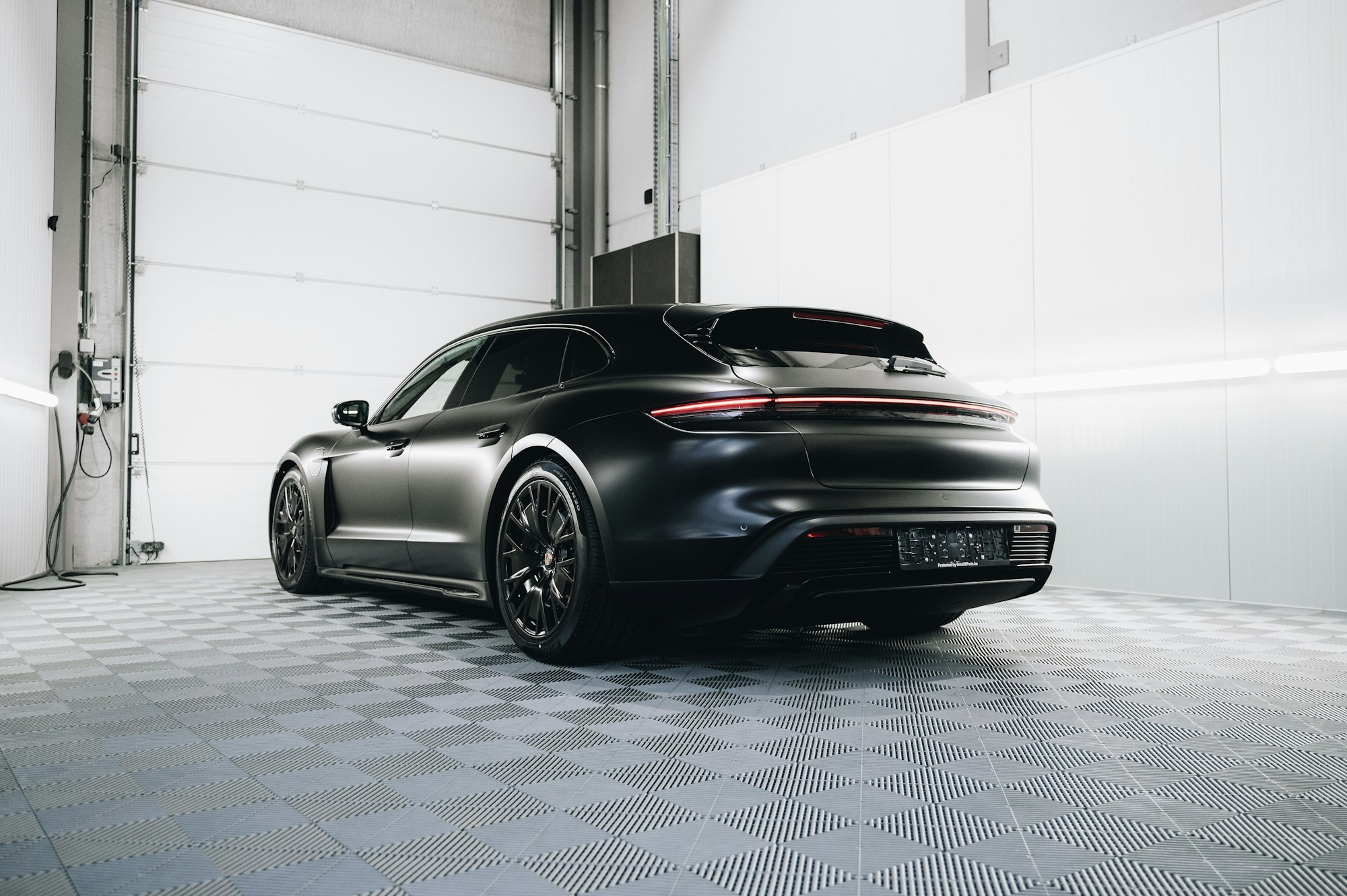 Sports car with a satin-matte finish in a studio